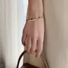 Circón chapado en oro francés para mujer, luz de nicho de Instagram con embalaje independiente y pulsera de sensación de alta gama
