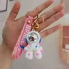 Cadeaux promotionnels de créateurs en gros Porte-clés 3D PVC kawaii personnage voiture porte-clés accessoires de chaîne de bande dessinée astronaute mignon SKCL