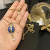Accessori di gioielli Collana a doppia catena con stella in pietra smaltata blu, scarabeo dorato, perla, regali per feste da donna 240311
