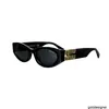 Designer 23 Nuovi occhiali da sole Versione alta Lettere MM Piastra da donna alla moda oro nero Occhiali da sole occhi di gatto SMU11W 9Z1Z