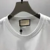 Summer Mens Designer T Shirt Casual Man Women Lose Tees z literami Drukuj krótkie rękawy