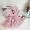 Set di abbigliamento Set di abbigliamento per ragazze 2023 Estate Nuove ragazze Cute Blossom Top + cinturino Mezza gonna Set Pastorale Principessa Stile Bambini Vestiti per ragazze