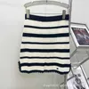 Two Piece Dress Designer 24 Spring/Summer High end New Fashion Color Contrasting Polo Neck Knitted Stripe Short Sleeves+Elastic Waist A-line Half Skirt Set FA50