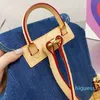 2024 Denim backpack exquisite gorgeous printing design women's backpack Cover buckle and multi pocket shoulder bag Blue