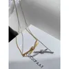 Designer Gu Ailings Cross Knot Necklace with the Same Style for Womens Light Luxury and Unique Design a High Grade Gold Elegance Celebrity Collar Chain