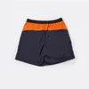 Casual shorts, sneldrogend, strandshorts voor heren, zwart oranje Pathwork-kleuren