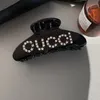 CLIPE DE CABELO GUICC COM CRISTAIS Clipe de acetato feminino com diamante francês