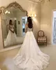 Graziosi abiti da sposa in pizzo a maniche lunghe con scollo a barca trasparente bottoni ricoperti di pizzo abiti da sposa trenino tulle country robe de marie