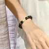 Strand-Armband aus schwarzem Sandelholz, minimalistisches kulturelles und künstlerisches Spielzeug-Armband, um die Finger gewickelt, weiches Griffstück mit einer einzigen Schlaufe