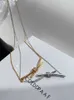 Collier de créateur Gu Ailings avec nœud croisé avec le même style pour femme, luxe léger et design unique, une chaîne de collier de célébrité élégante en or de haute qualité ST3G