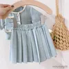 Kläderuppsättningar 2023 Spring Summer New Girls Clothing Set Cute Button Short Sleeve Top och veckad kjol 2st Girls Fashion Baby Kids Outfit