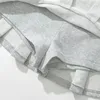 KEYANKETIAN Женская махровая ткань с низкой талией Y2K Мини-юбка с широкими складками и украшениями Светло-серая воланная юбка трапециевидной формы милая 240307