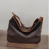 Sacs de soirée Grande capacité Sac seau d'eau Sac à bandoulière pour femme Fourre-tout Couche de tête de vache Style coréen Sac à main en cuir véritable Casual