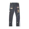 Męskie spodnie Trend Graffiti High Street Hip Hop Spita w stylu amerykański liter druk patchwork spodni design sens unisex długie spodnie