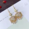 Boucles d'oreilles pendantes originales de style chinois brillant Ruyi Glands calcédoine naturelle pour femmes classiques élégantes boucles d'oreilles bijoux