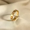 New Love Ring Designer Design 18K Gold plaqué Titanium Steel Ring Classic Bijoux Mâle et Femelle Anneau de fiançailles MODE