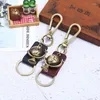 Keychains Fashion Vintage Bronze Globe Charm Keychain Retro Leather Pendant Alloy Spuckle Keyring For Bag Car Keys Chain Women Men SMYELLT