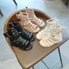 HBP Non-Brandneue Bogen Kinder Baby flache hohle römische Schuhe Kinder hohe Röhrenriemen flache Sandalen für Mädchen