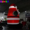 10mH (33 фута) с воздуходувкой. Фантастический гигантский рождественский надувной Санта-Клаус с зелеными перчатками. Вентилятор с черными ремнями для наружного украшения.
