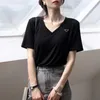 デザイナーTシャツの女性トップ