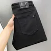 Jeans da uomo firmati Luce di lusso Qualità Autunno e inverno Slim Fit Elastico di fascia alta Versatile Nero Bianco Pantaloni a gamba dritta per tutte le stagioni 7X8Z