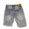 Pantaloni corti di jeans da uomo estivi con foro Pantaloncini di jeans a cinque pezzi raschiati da mendicante 240313