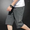 Herrbyxor sommar tunna is silkeshorts bokstav tryckning lös elastisk midja fast färg sport casual mode män kläder