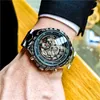 Swatch äkta klocka Mens mekaniska ihåliga botten trend vattentät lysande svart teknik klocka