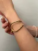 Charm armband geometriska oregelbundna flödeslinjer mode öppna armband tvåfärgade glansiga