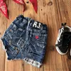 Mode flickor denim kjol barn fickor oregelbundna kanter cowboy kjol 2024 vårbarn lapptäcke casual jeans kort kjol s1218