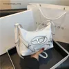 Pas cher en gros liquidation limitée 50% de réduction sac à main nouveau Sier Dingdang sac grande capacité doux cool épicé fille style moto unique épaule sous les bras fourre-tout