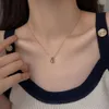 Collier minimaliste en acier titane goutte d'eau pour femme