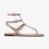 2024 mode sexig läder mocka damer sandalswomens svarta båge flip-flops kvalitet sandaler sommarstrand nitade tofflor mode casual platt botten nagelskor