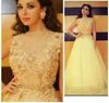 Mayiam Fares Dresses 2015 Sheer Yellow Spets A Line Bateau halsringning Tulle Appliqued Celebrity Dresses With Sash6449128