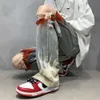 Spray Tryckta jeans nödställda hål, trendiga Instagram High Street Men's Oldschool med en designkänsla av lyx och tiggare byxor