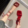 Sandaler sexiga höga klackar kvinnor Rom skor sommarklänning party cross bind-spets upp tofflor 2024 designer pumpar mujer zapatillas