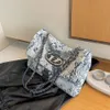 Pas cher En Gros Liquidation Limitée 50% Remise Sac À Main Halo Teint Chaîne Sac Femmes Grande Capacité Nouvel Été Polyvalent Denim Tissu Texture Populaire Une Épaule