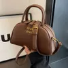 Borse di marca di moda all'ingrosso transfrontaliere Borsa da donna Nuova tracolla a spalla singola trendy e di alta moda Piccola conchiglia semitonda portatile