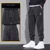 Pantaloni da uomo Pantaloni casual in cotone Piumino invernale in lana d'agnello da uomo Abbigliamento sportivo da jogging Solido pile con coulisse