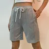 Löpande shorts solid färg stilfulla kvinnors elastiska midja dragskon med fickor för sommar fitness casual wear