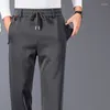 Pantalon pour hommes 2024 simplicité loisirs polyvalent printemps automne couleur unie poche élastique pour les affaires jambe droite sport ample