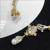 Bracciale rigido Gioielli e accessori marchio di lusso con teschio incoronato e ciondolo con perla bracciale in metallo bicolore aperto per regali da donna e da uomo 240319