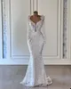 Abito da sposa scintillante a sirena Sexy scollo a V maniche lunghe perline Abiti da sposa in pizzo Abito da sposa illusione Robe De Mariee