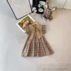 2024 Sommer Mädchen Bogen Plaid Kleider Kinder Rüschen Fly Sleeve Gitter Kleid Adrette Kinder Baumwolle Designer Kleidung S1228