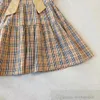 2024 Sommer Mädchen Bogen Plaid Kleider Kinder Rüschen Fly Sleeve Gitter Kleid Adrette Kinder Baumwolle Designer Kleidung S1228