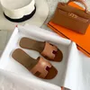 Designer Oran tofflor glider sandaler för kvinnors tofflor Casual loafers skor utomhus strandskivor platt botten med spänne unisex äkta läder