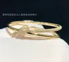 AA Designer Charm Bangle Armband Tifant Love Knot Armband 925 Sterling Silver 18K Gold Cross Knot Set med Diamond Elegant Double Layer Wrapped Knot XL1X