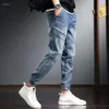 Pantalon de jeans pour hommes harem pantalon de cowboy masculin épissé pour les hommes cargo haruku baggy empilé par un denim original de style coréen