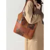 Bolsos de marca de moda al por mayor transfronterizos Nuevo panel de cuero suave Bolso de cubo de gran capacidad Bolso de mano con un solo hombro para mujer Versátil