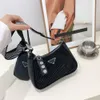 Acquista al banco vendita di borse I produttori vendono posta gratuita in perdita Nuova borsa da trapano calda Moda donna Spalla casual Bambino Madre Crossbody